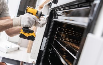 Home Appliances Technician Installing a Stove